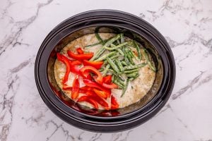 green beans and bell pepper added to slow cooker