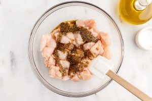 seasoning poured over chicken