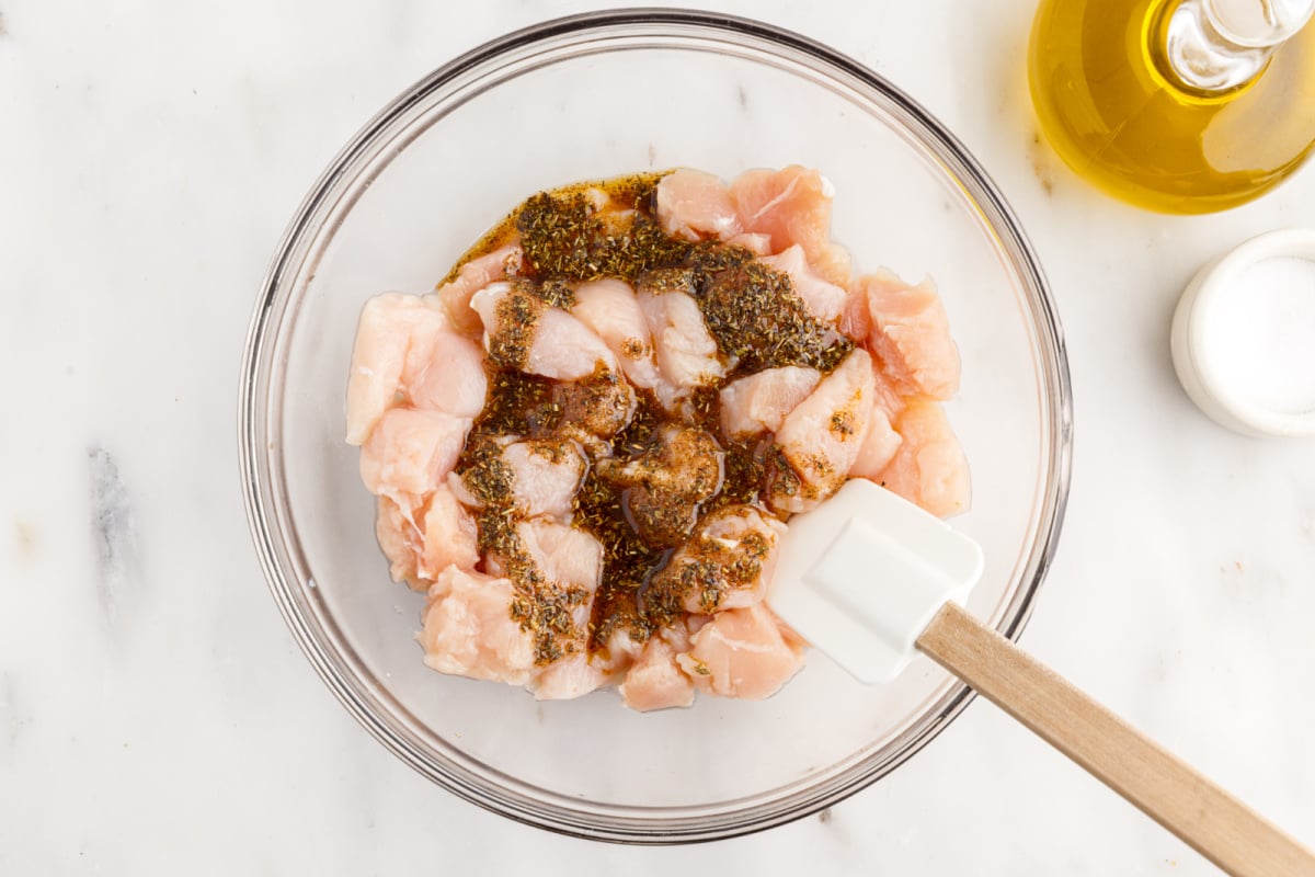 seasoning poured over chicken