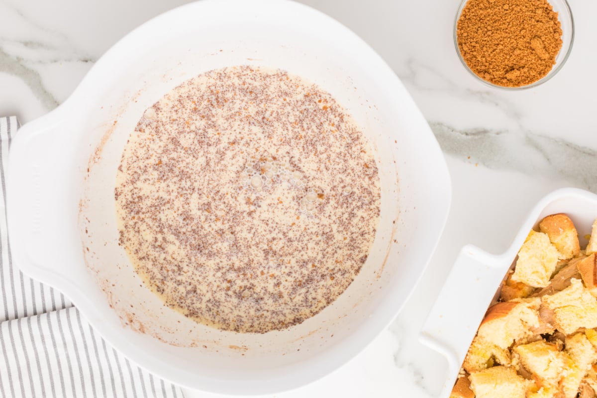 eggs, milk, cream, vanilla, and cinnamon in a bowl