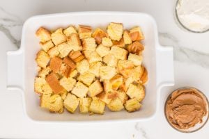 bread cubes put into a baking dish