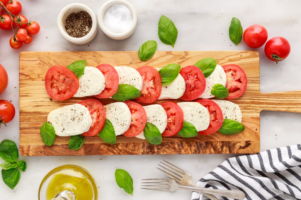 salt and pepper added to top of tomatoes and cheese
