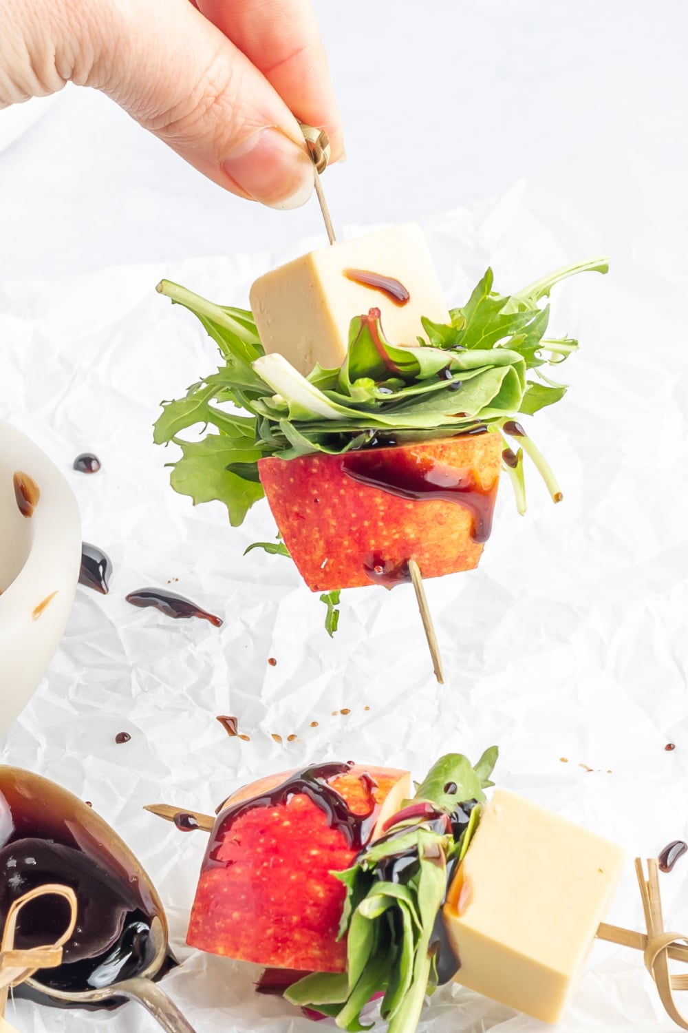 holding a Cheddar Apple Salad Skewers