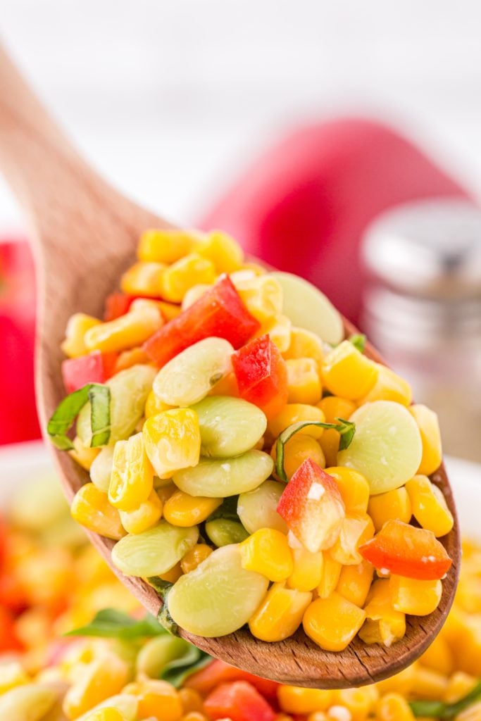 Corn Succotash on a wooden spoon