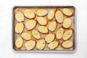 baguette slices on baking sheet