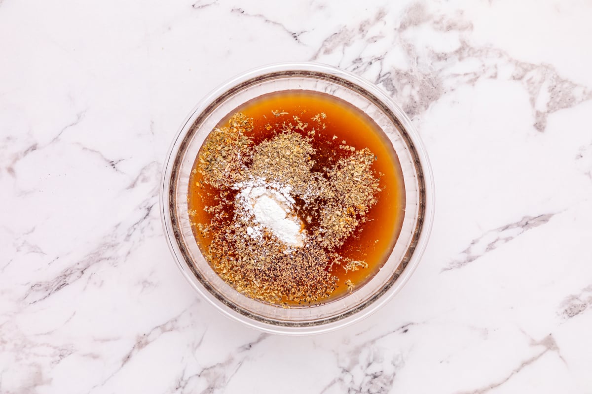 beef broth, ketchup, red wine vinegar, Worcestershire sauce, cornstarch, Italian seasoning, cayenne, salt, and pepper in a small bowl