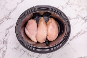 chicken placed in slow cooker