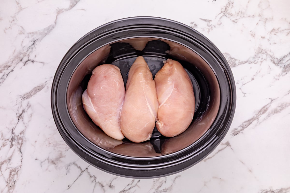chicken placed in slow cooker