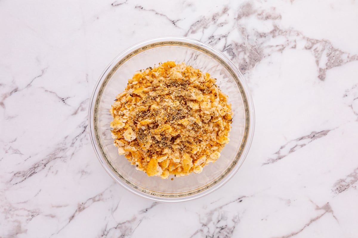 crumbled Ritz crackers and Italian seasoning added to bowl with butter