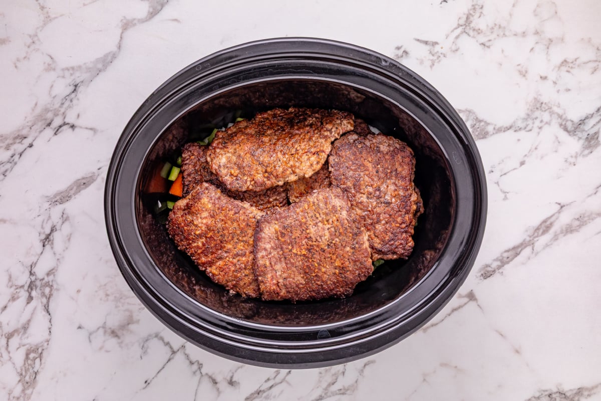 browned beef added to top of veggies