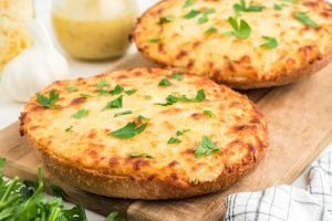 Three Cheese Garlic Bread on a cutting board