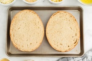 loaf slices on a baking pan