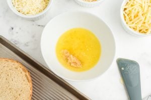 melted butter, minced fresh garlic, and Italian dressing in a bowl