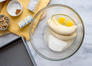 sugar, bananas, vegetable oil, and eggs in a bowl