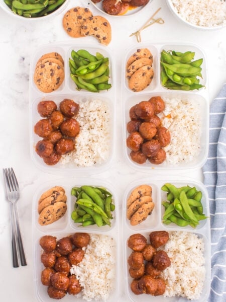 4 lunchboxes with Meatballs and Rice, edamame and cookies