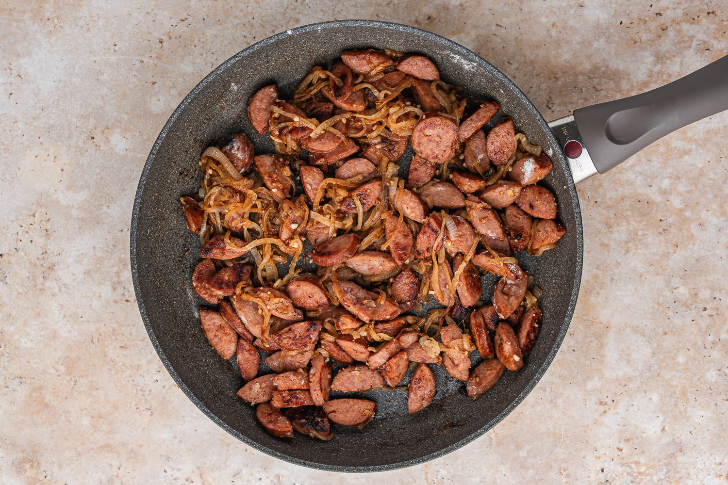 garlic and sausage added to pan