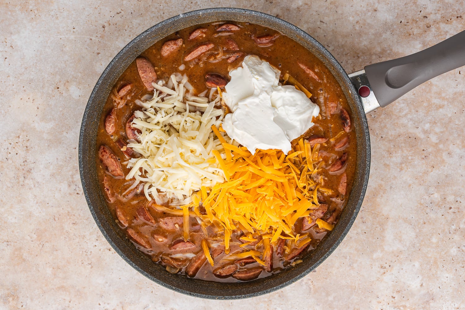 sour cream and cheeses added to pan