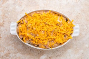 shredded cheese added to casserole dish