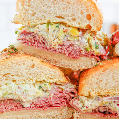 Grinder Sub Sandwiches stacked on a plate