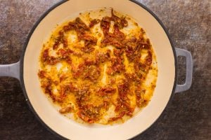 flour, Italian seasoning, and red pepper flakes added to pan