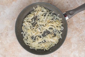onions cooking in a pan