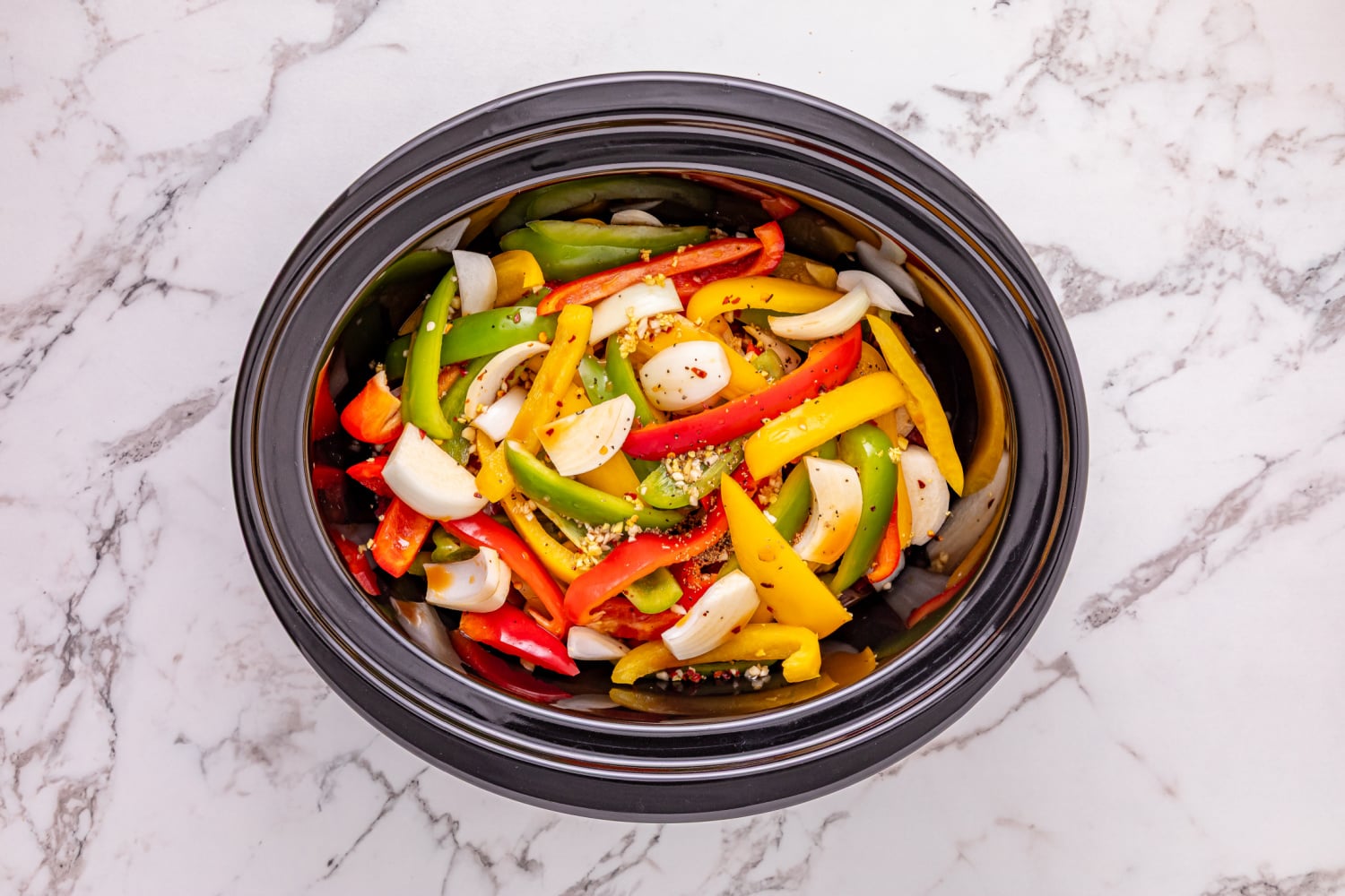 sauce poured over veggies and steak in slow cooker
