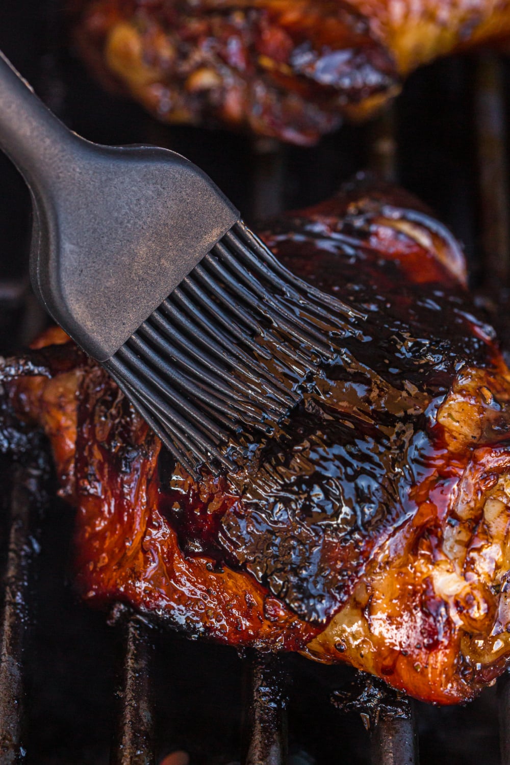 brushing glaze on chicken