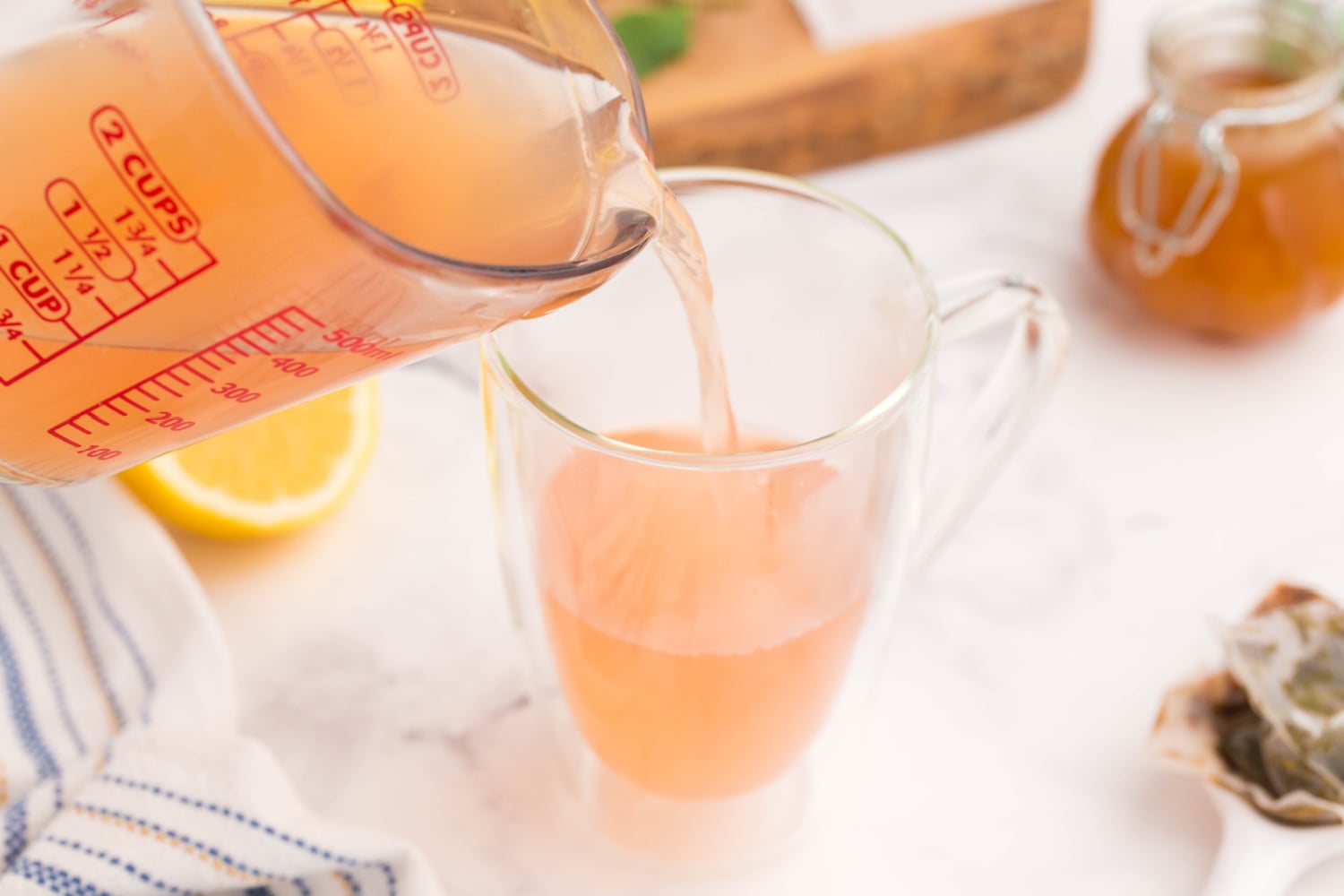 pouring tea into a cup