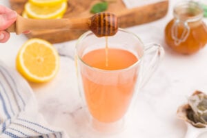 honey being added to tea