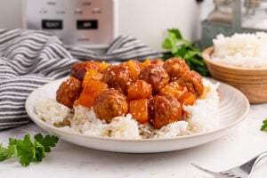 Slow Cooker 3 Ingredient Hawaiian Meatballs on a plate with rice