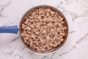 ground turkey cooking in a pan