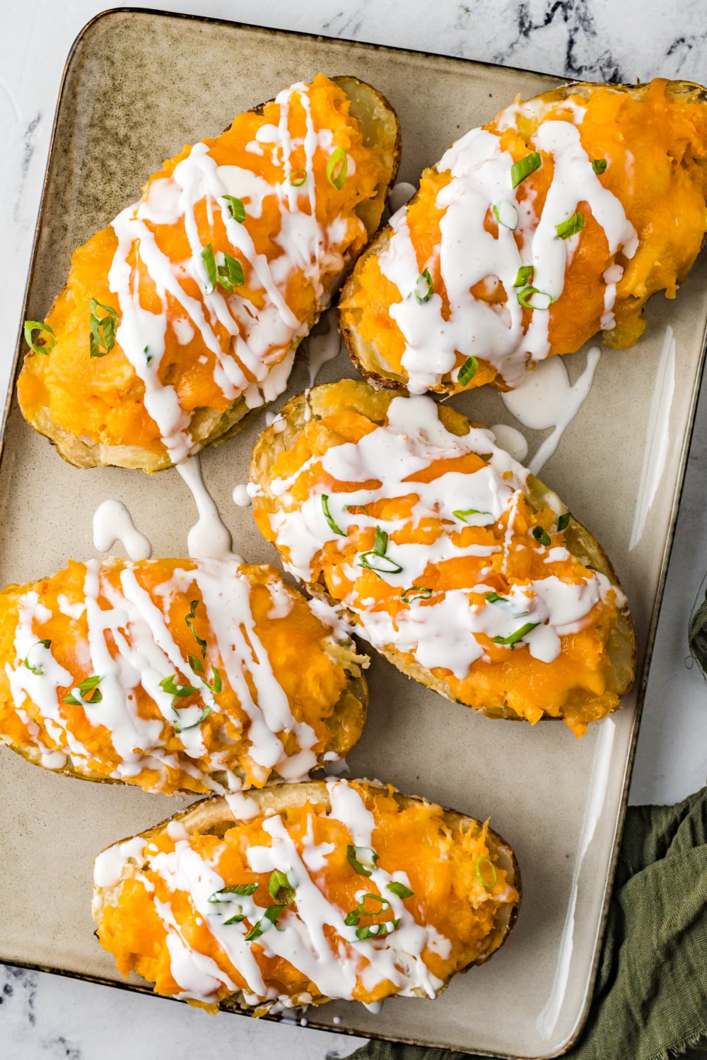 Buffalo Chicken Stuffed Potatoes on a baking sheet