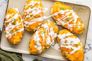 Buffalo Chicken Stuffed Potatoes on a baking sheet