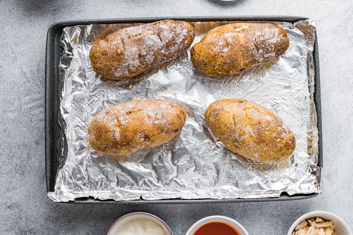 cooked potatoes on a baking sheet