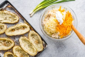 hollowed out potatoes and a bowl of potato filling
