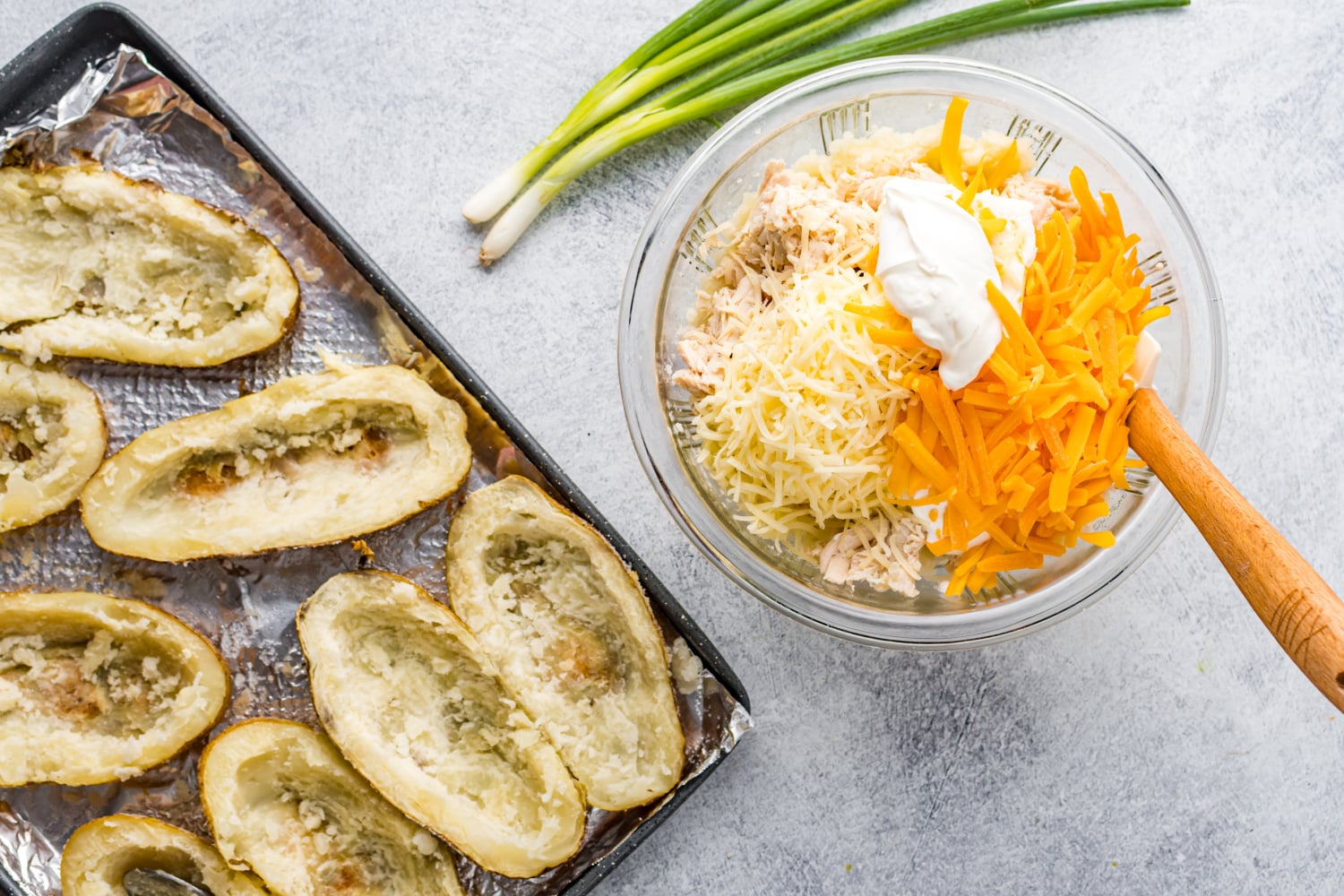 hollowed out potatoes and a bowl of potato filling