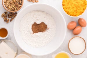 dry cake mix and pumpkin pie spice in a mixing bowl