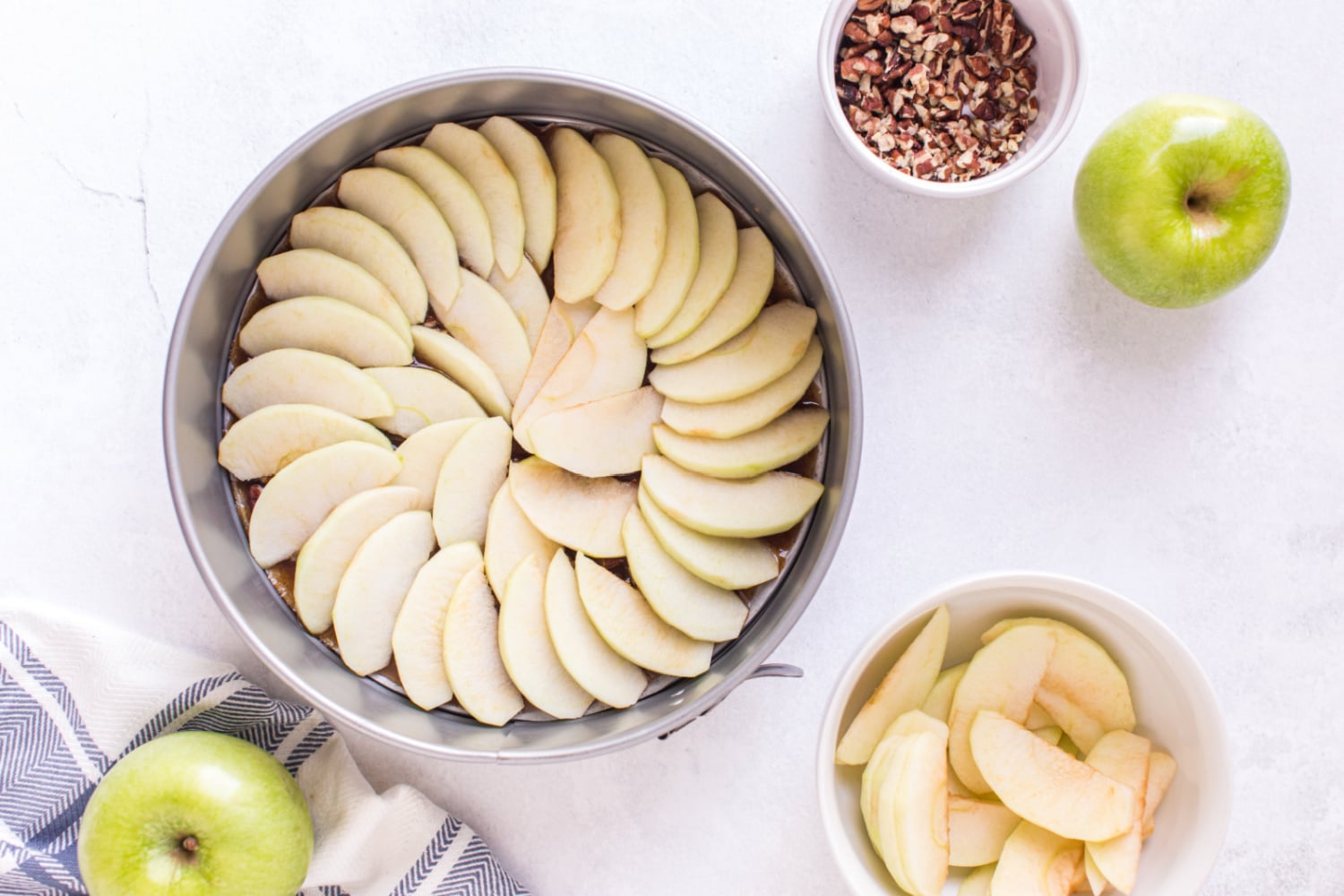 apple slices layered over nuts