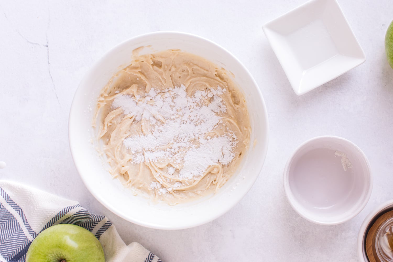 baking powder, salt and cinnamon added to bowl