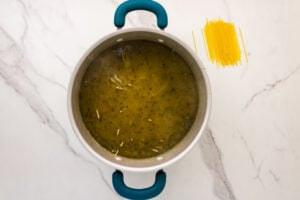 noodles added to soup pot