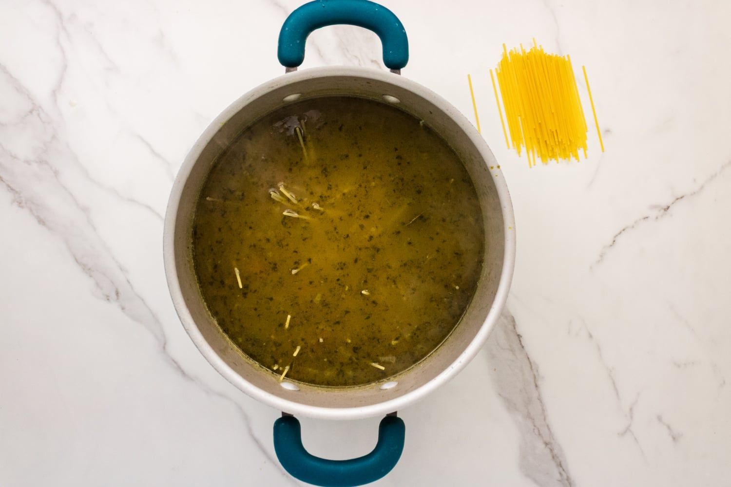 noodles added to soup pot