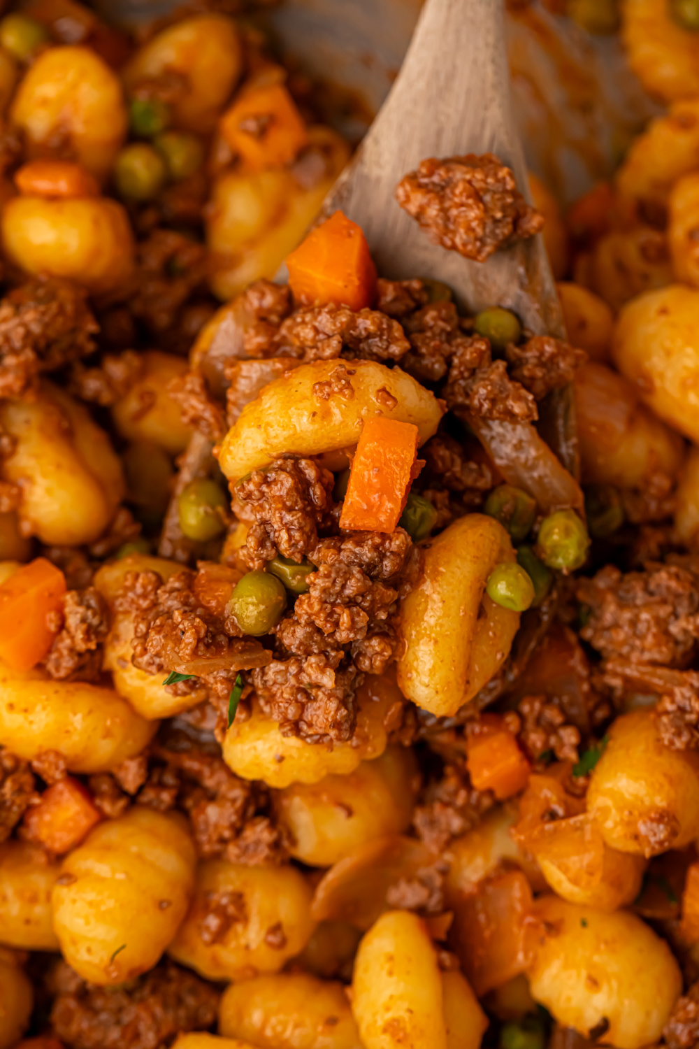 Gnocchi Shepherd’s Pie scooped up with a wooden spoon