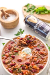 scooping up chili with a spoon