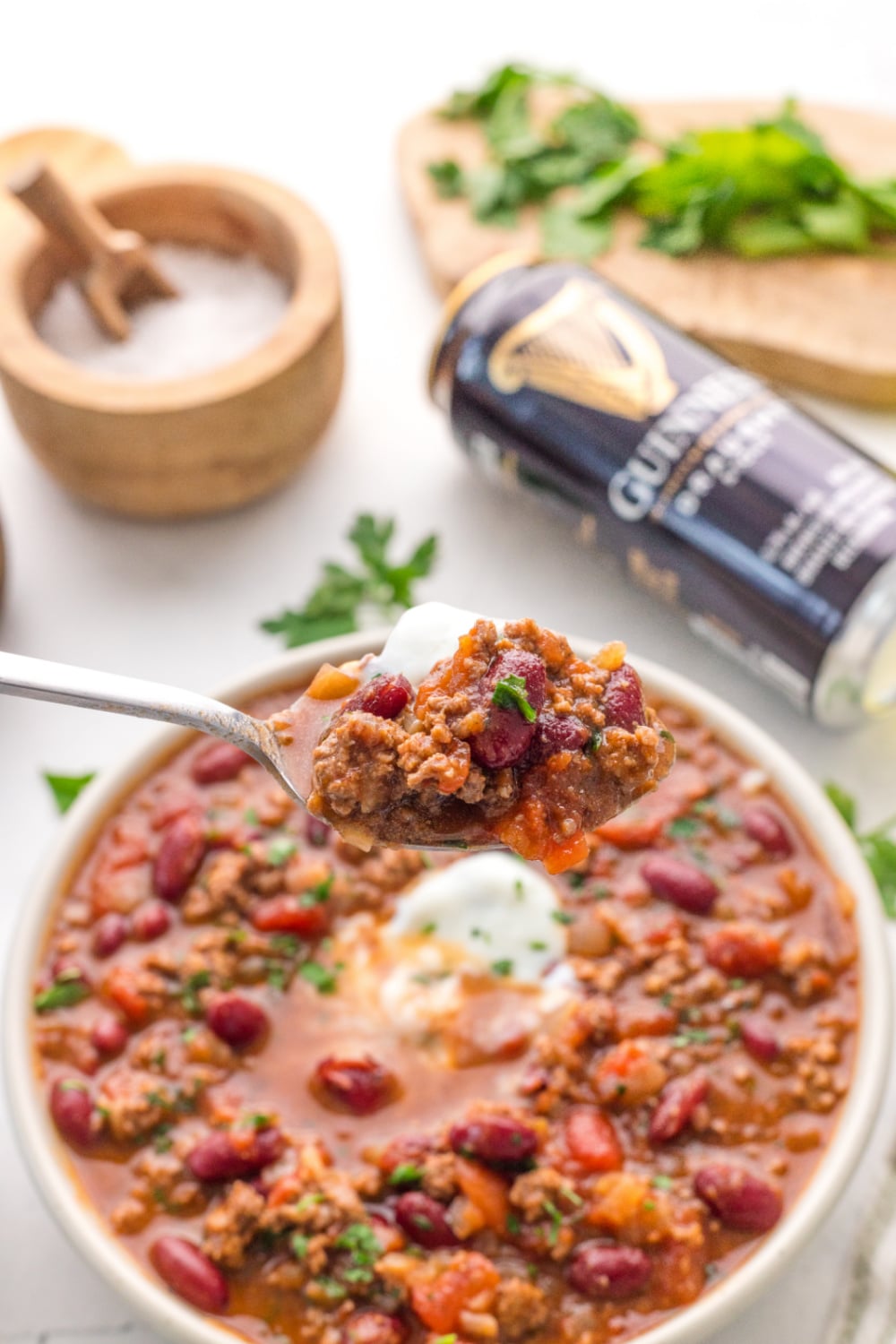 Guinness Chili in a bowl topped with sour cream