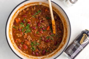 wooden spoon stirring Guinness Chili