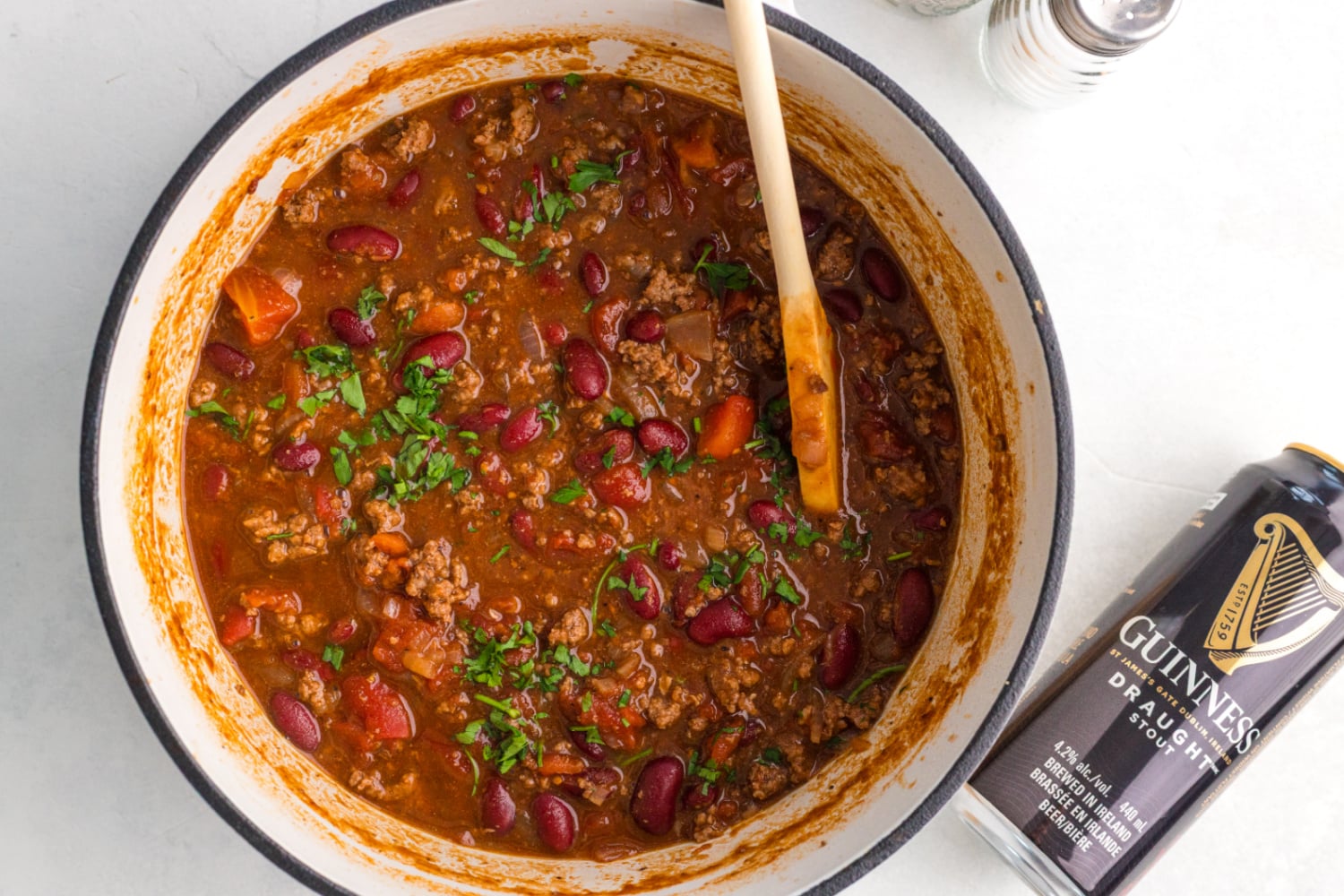 wooden spoon stirring Guinness Chili