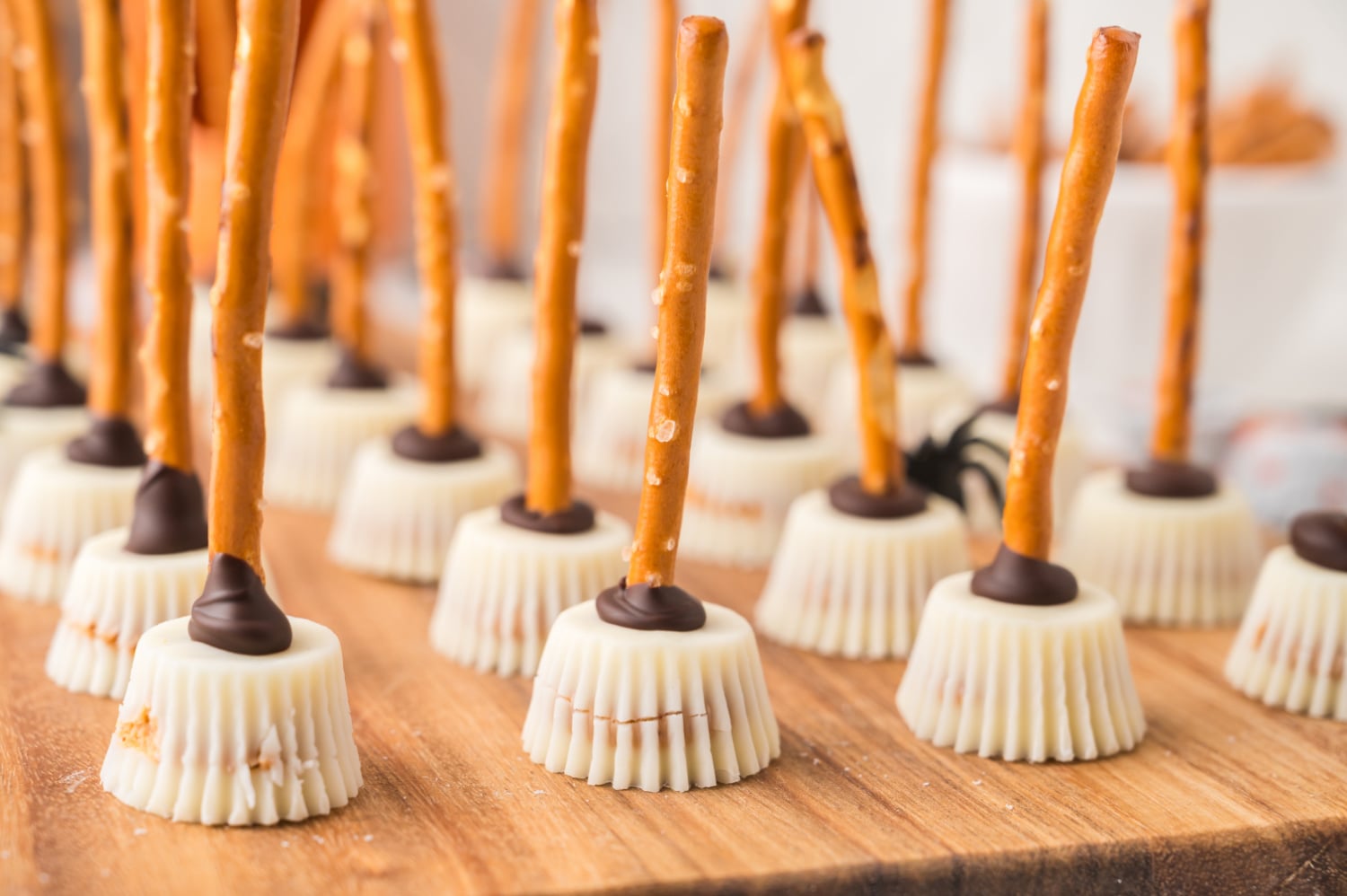 pretzels dipped in chocolate inserted into mini pb cup