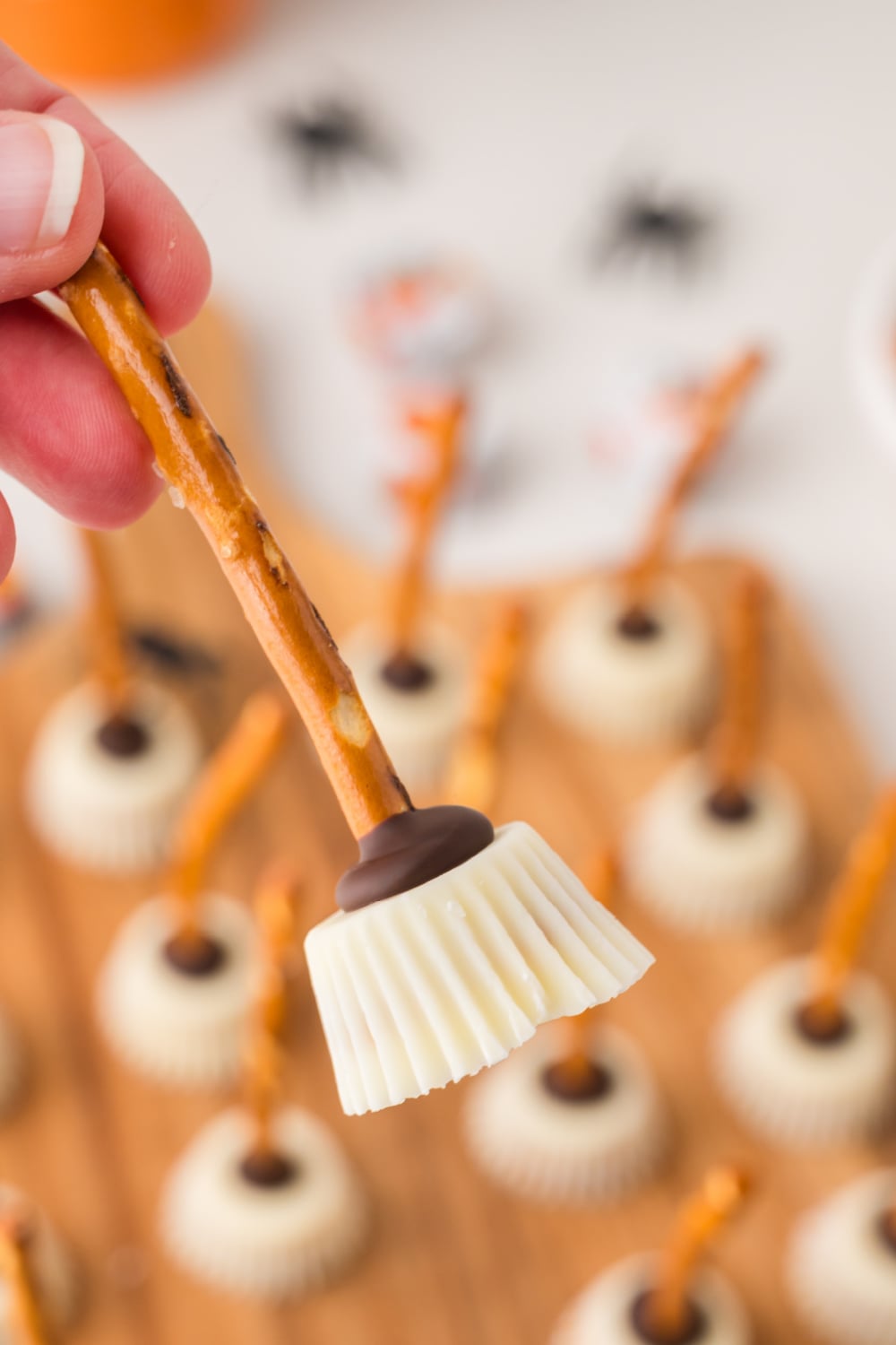 Hand holding Halloween Witch Broom Snack