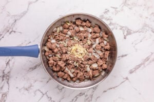 ground beef, onion and garlic in a pan